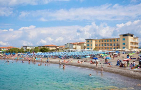 ISA-Double room with balcony and side sea view in hotel with swimming pool in Marina di Cecina, just 10 meters from the sea